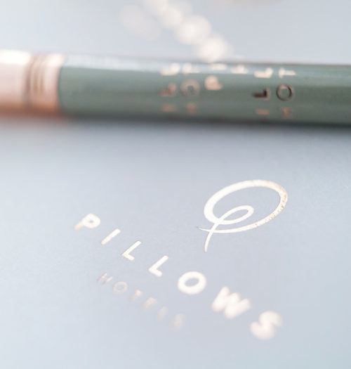 Pencil and notebook of Pillows Hotels