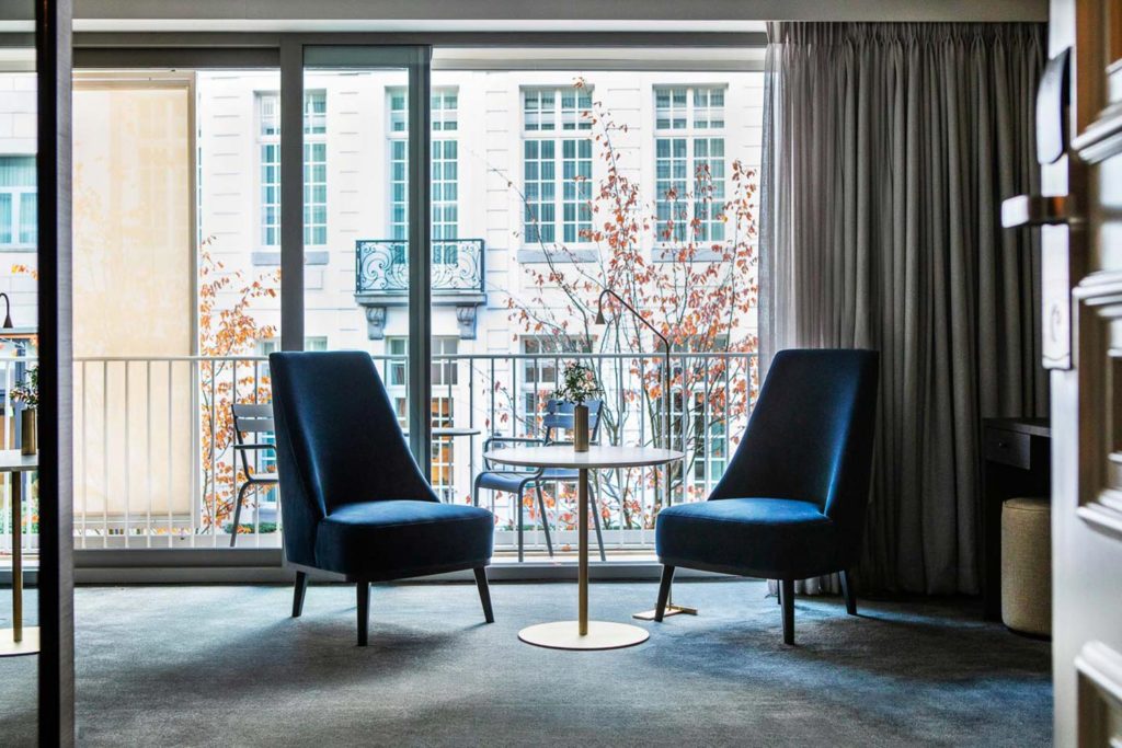 Two blue chairs in a hotel room in Ghent